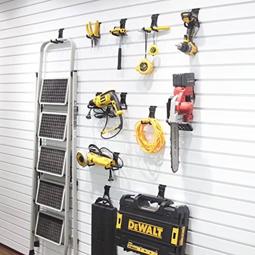 Black slatwall U hooks on garage wall holding tools, multi-hook display