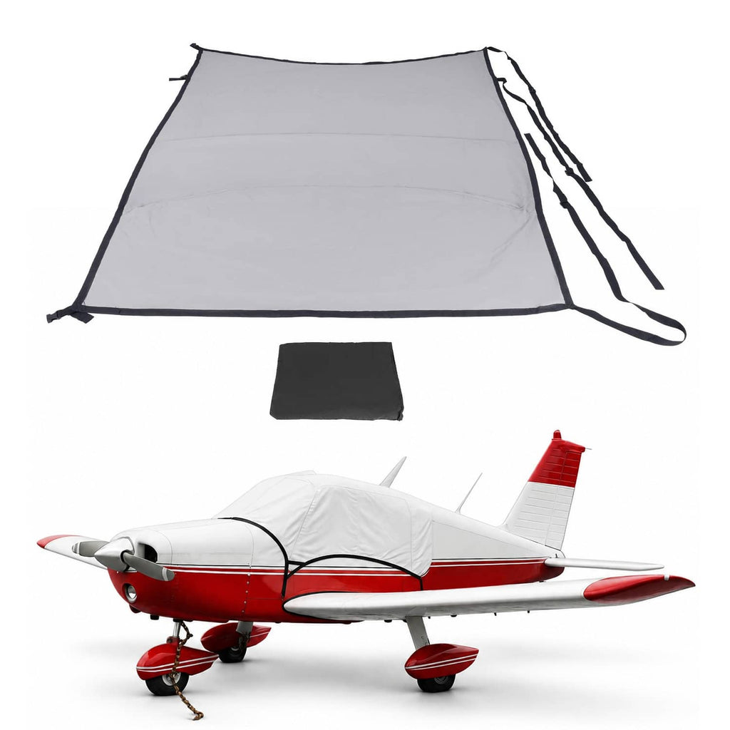 Gray aircraft cabin and windshield cover with black trim and securing straps
