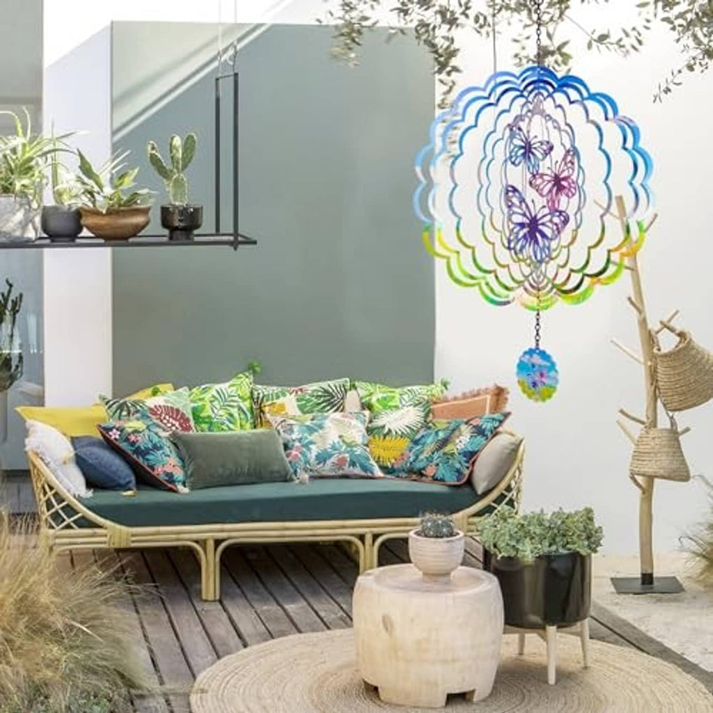 Butterfly wind spinner with blue scalloped metal petals and hanging floral charm