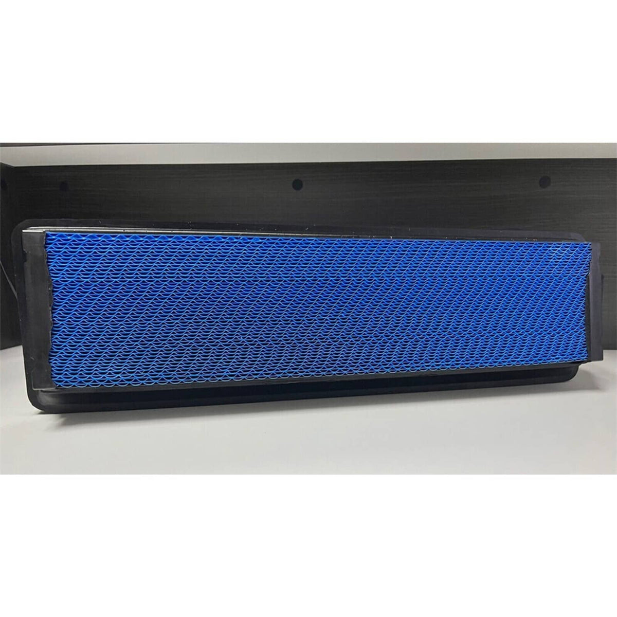 Blue mesh air filter panel in black frame, shown inside a rectangular slot