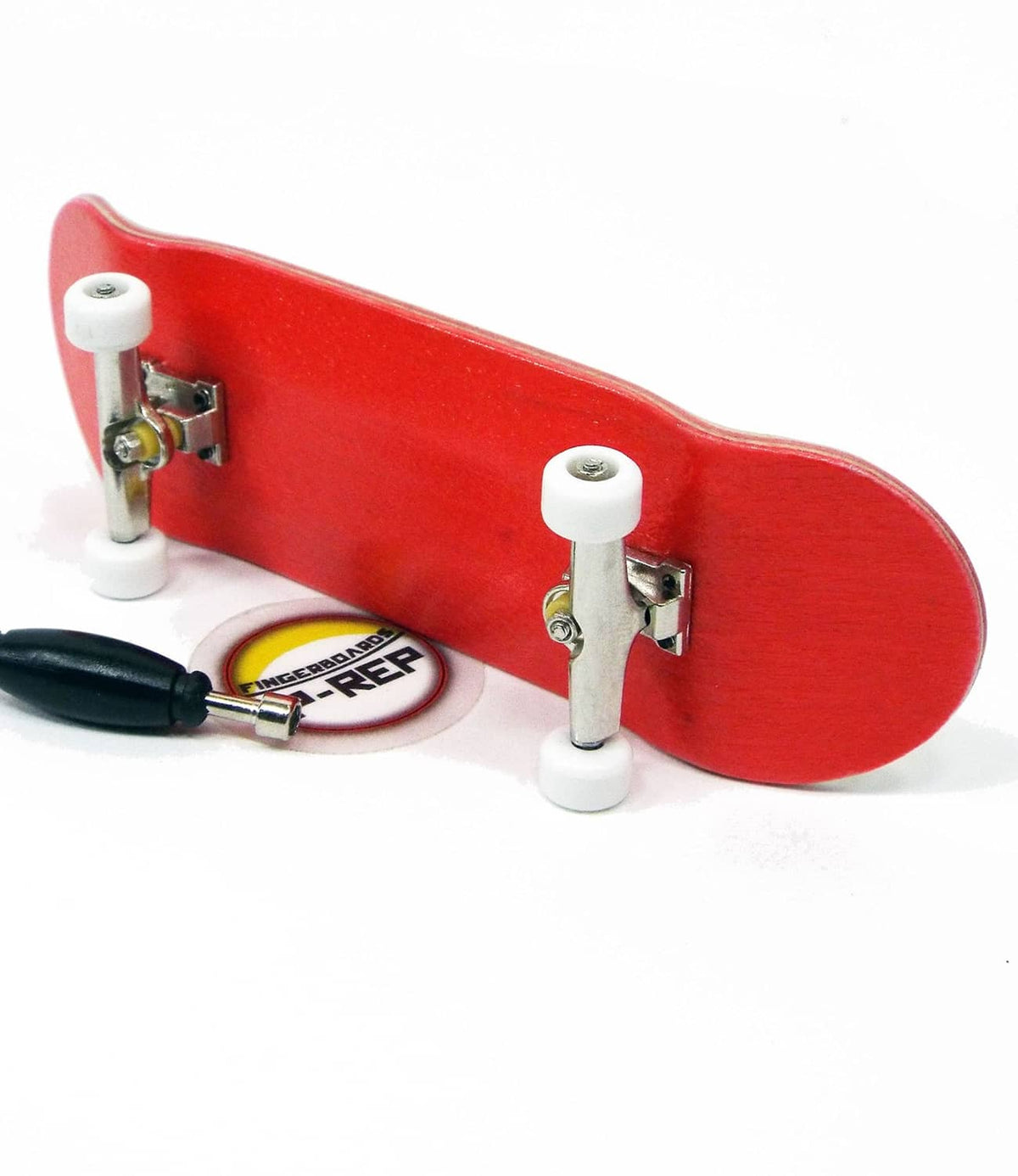 Red wooden fingerboard deck with white wheels, metal trucks, and small accessories