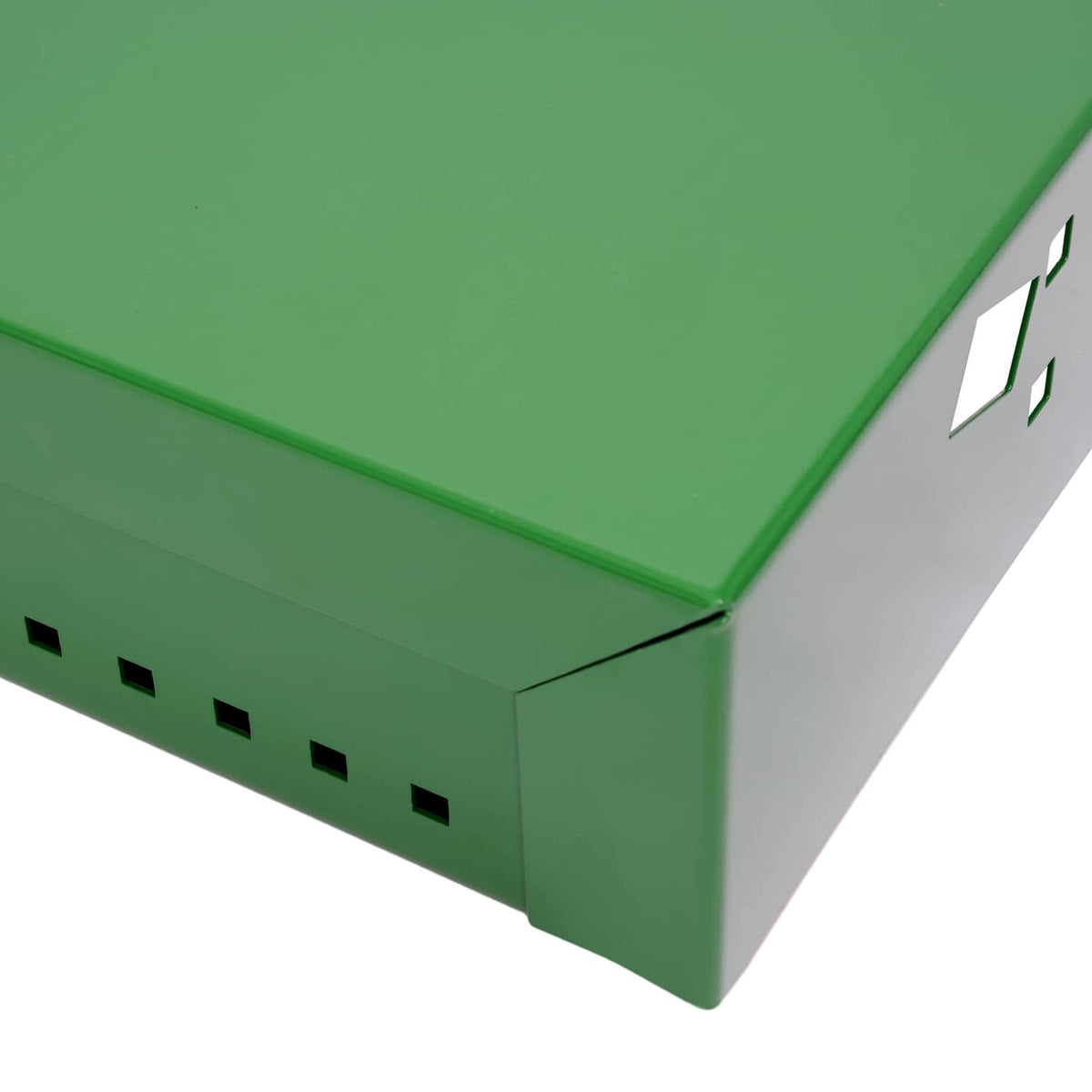 Close-up of green metal battery box with perforated vent holes along the side
