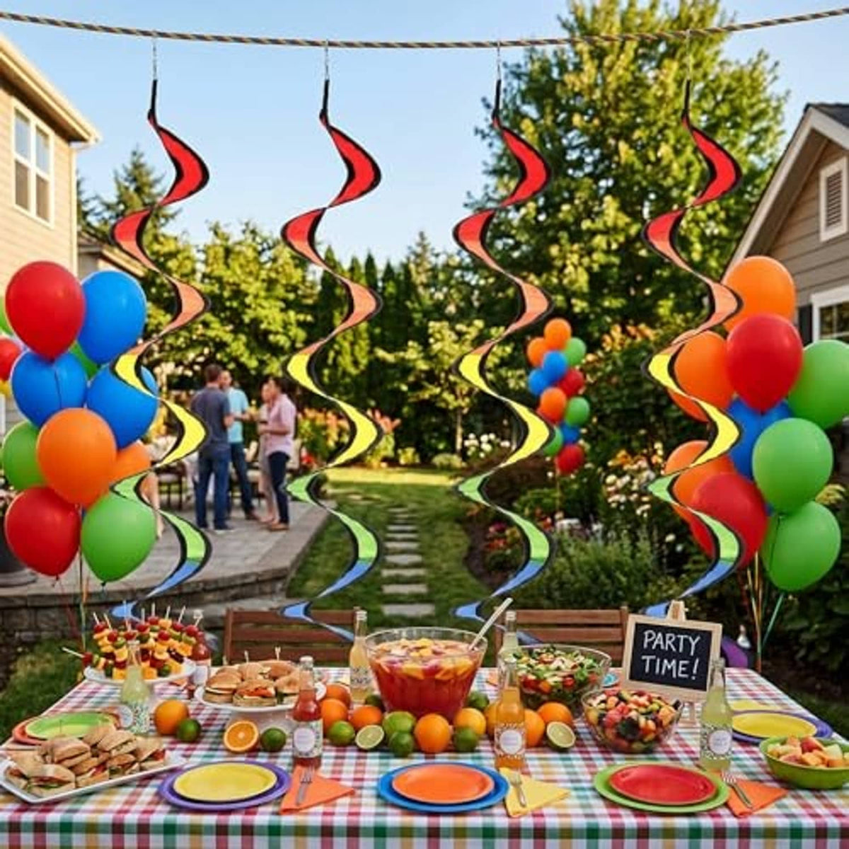 Rainbow wind spinner swirls hanging along a backyard party with balloons