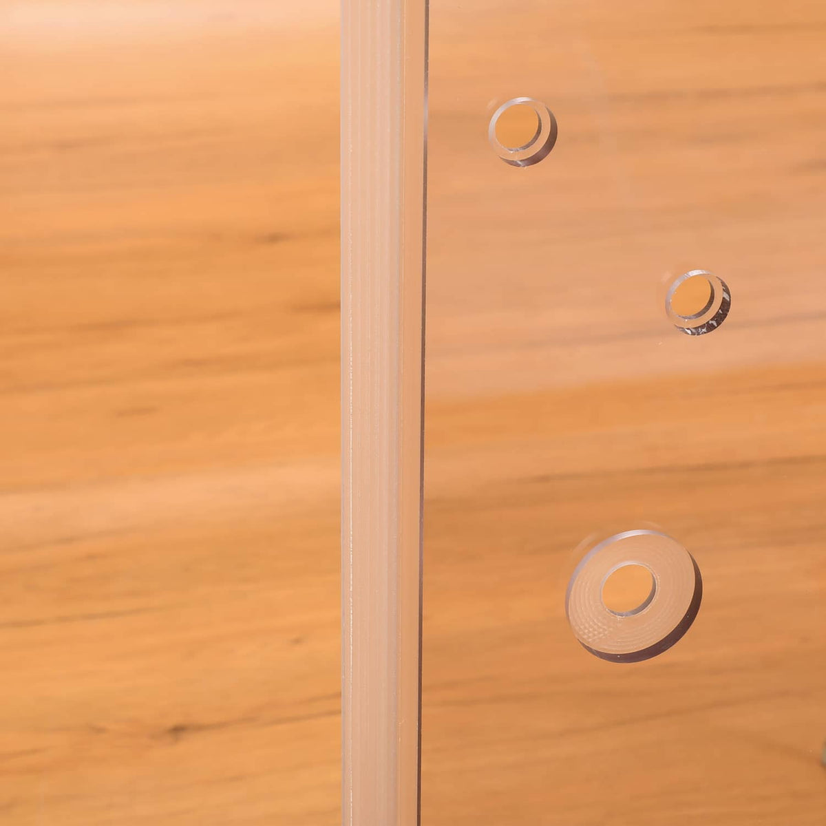 Close-up of door glass window fasteners on clear plastic panel