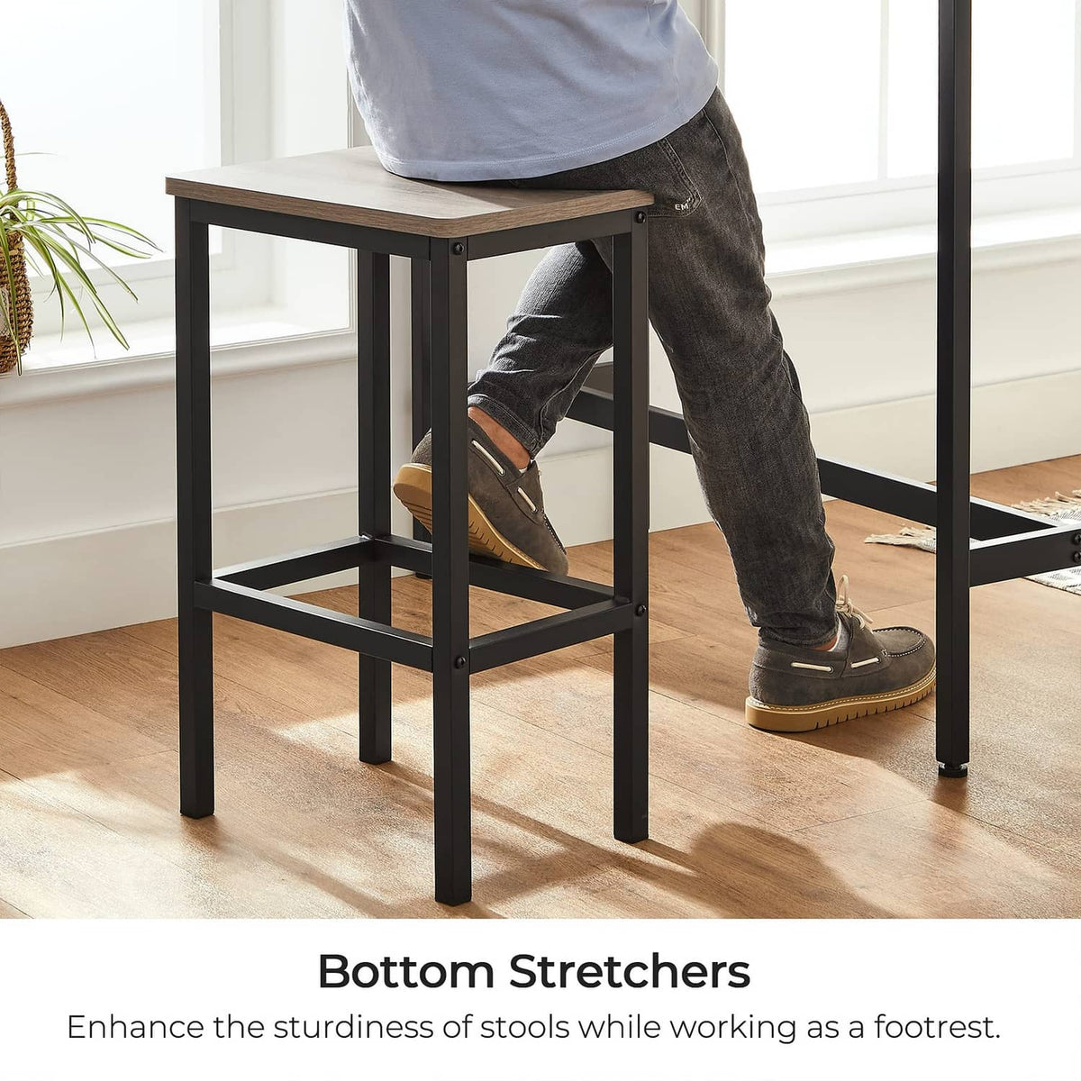 Greige bar stool with bottom stretchers and open lower footrest frame
