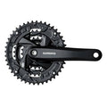 Bike front triple chainring crankset with black Shimano crank arm and sprocket