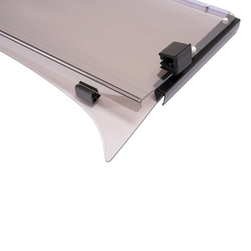 Tinted windshield close-up showing black latch clips and clear smoke panel edge