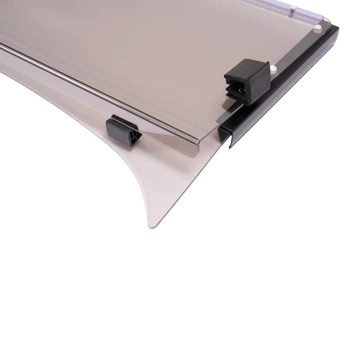 Tinted windshield close-up showing black latch clips and clear smoke panel edge