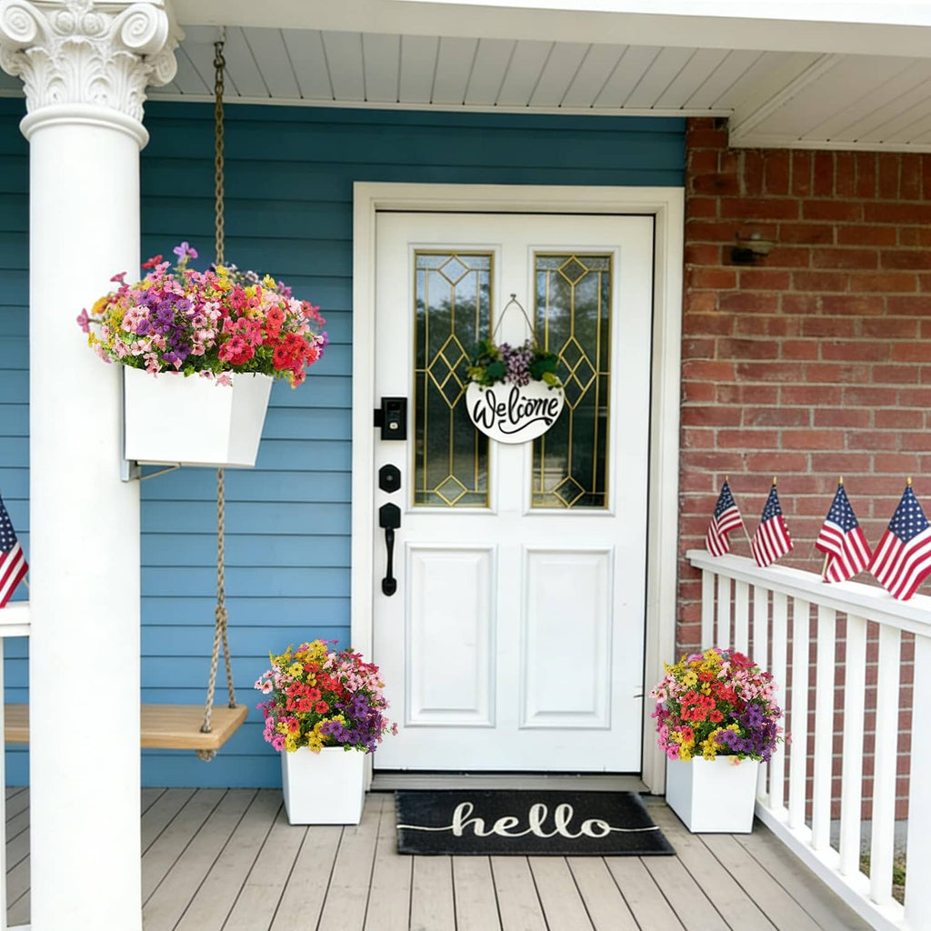 Hanging and potted artificial flowers in mixed pink, purple, and yellow on porch