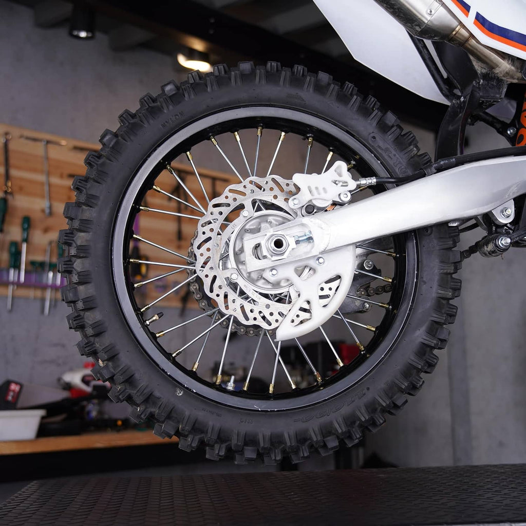Dirt bike front wheel with installed black inner tube and visible tire tread