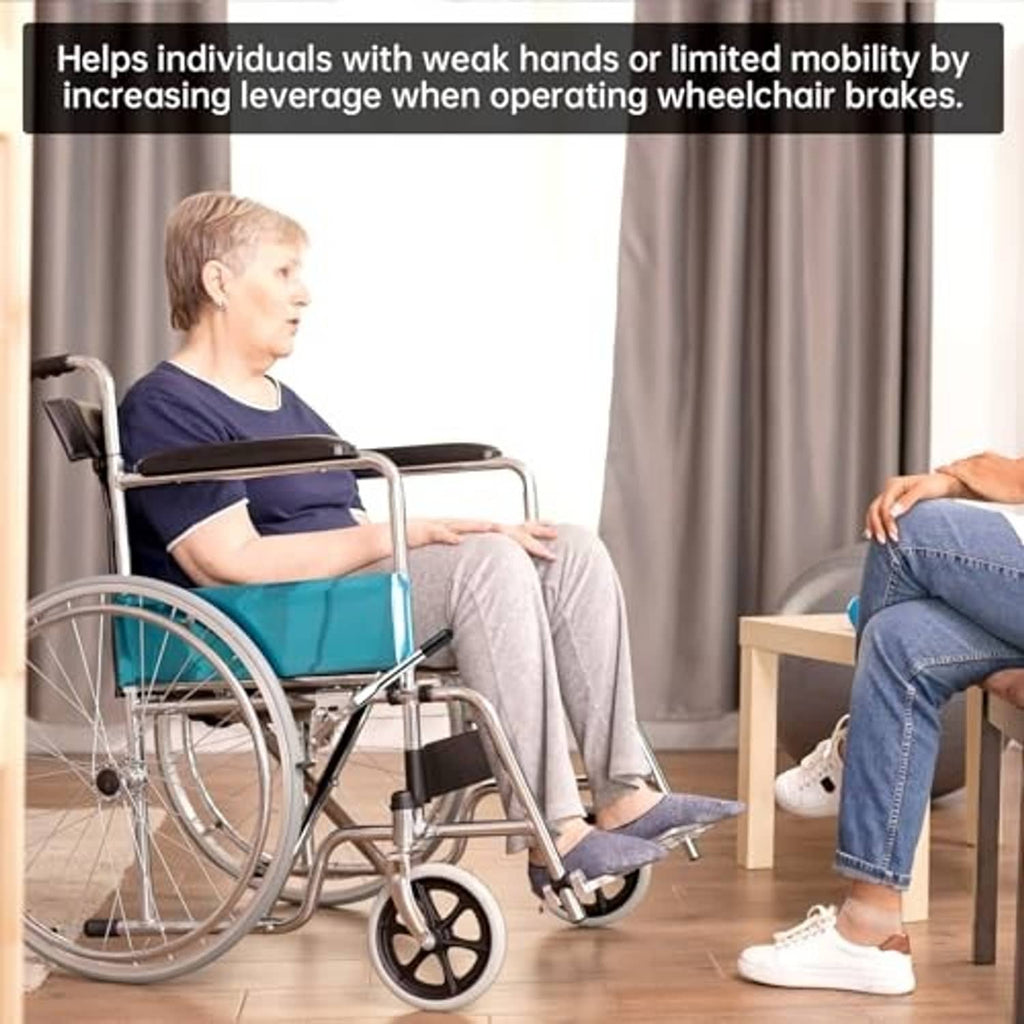 Wheelchair brake lever extender attached; silver metal with black rubber end cap