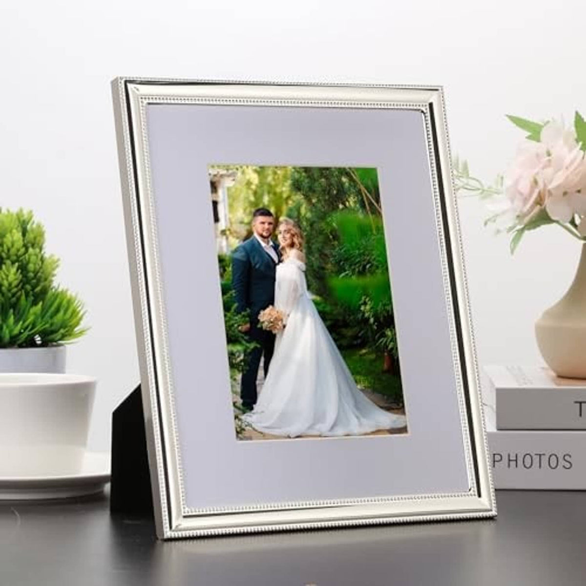 Silver metal 8x10 picture frame with white mat and portrait photo, beaded border