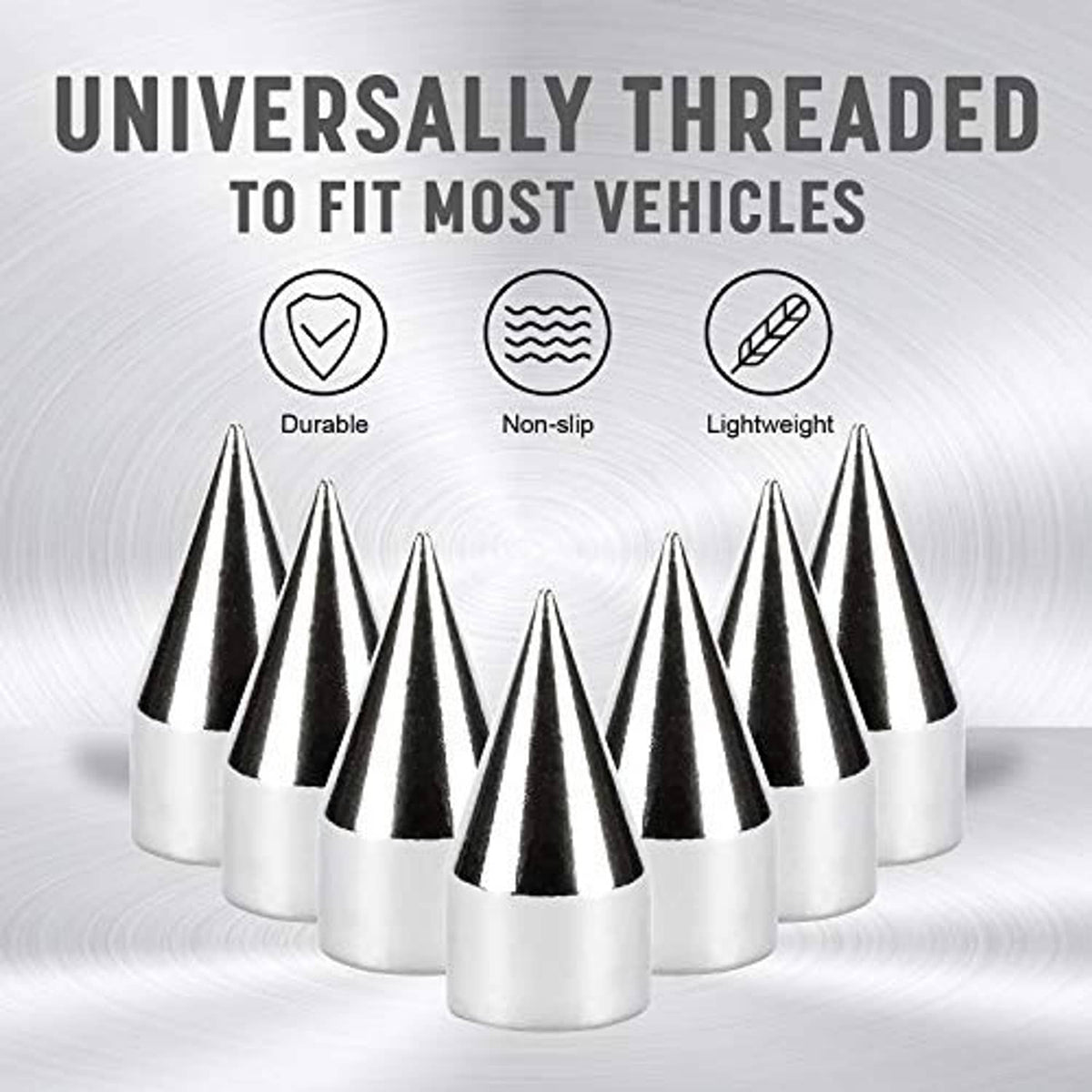 Four silver chrome spiked valve caps standing in a line with pointed cones