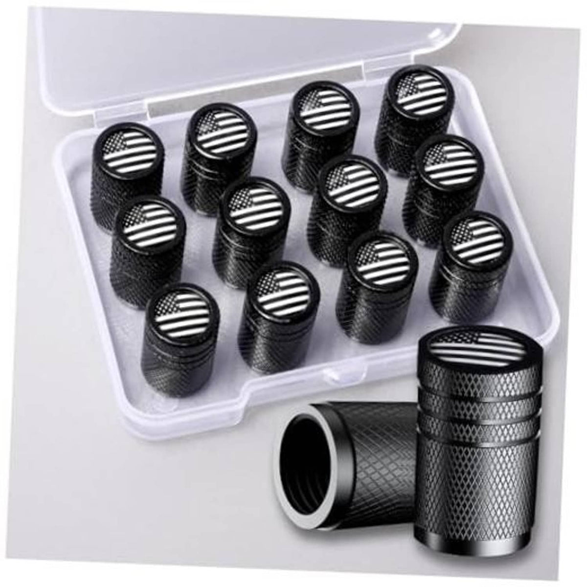 Set of 12 black aluminum tire valve stem caps with raised American flag round tops