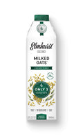 Unsweetened oat milk carton with Elmhurst Milked Oats front label and oat graphic.
