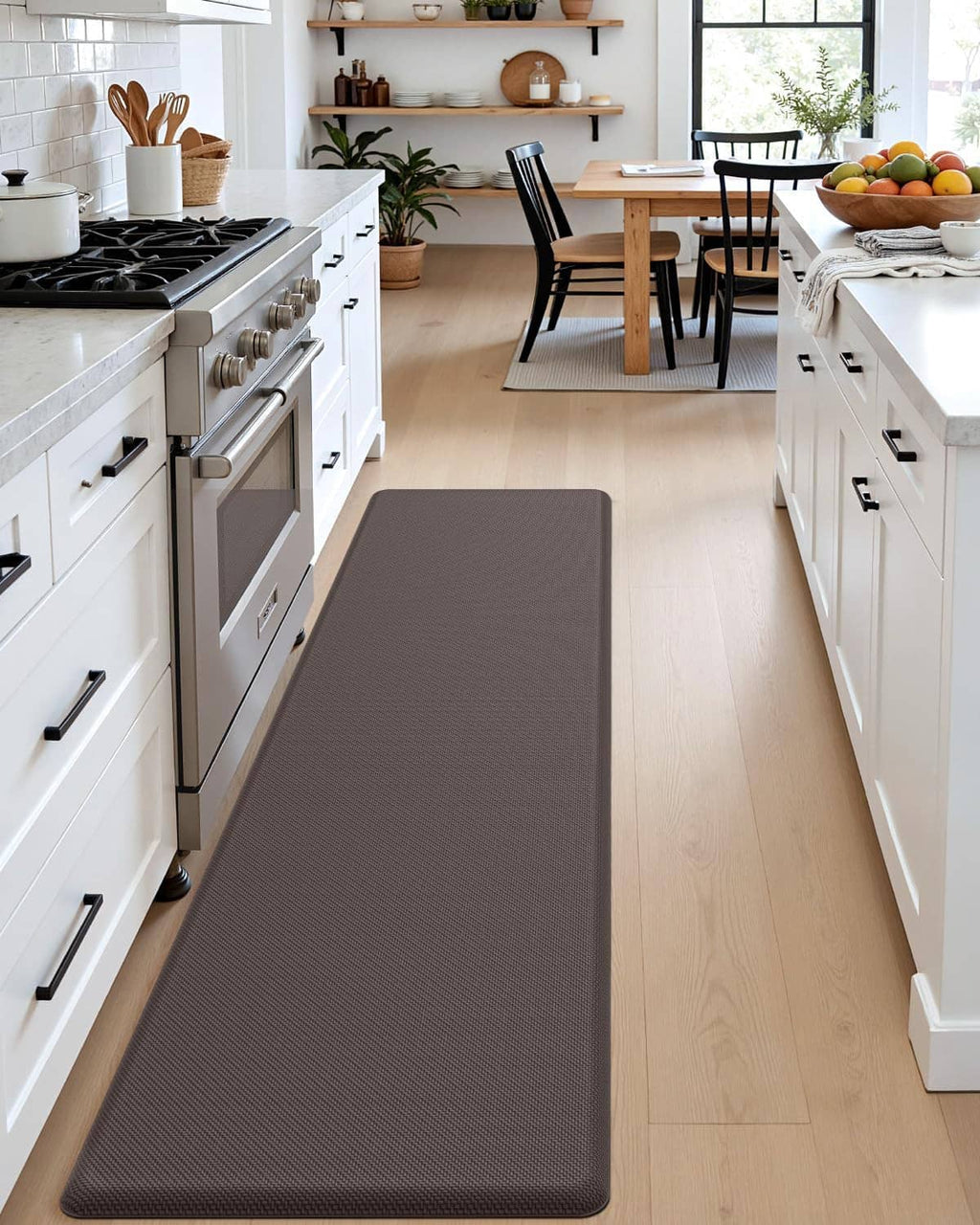 Long dark gray kitchen floor mat centered in a narrow galley kitchen