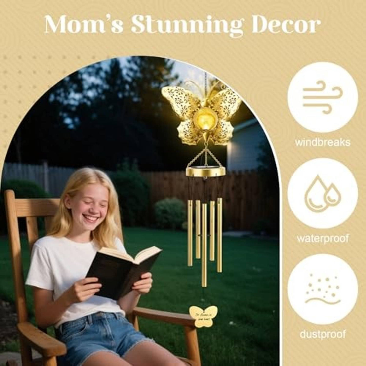 Golden butterfly solar wind chime with ornate wings and glowing glass ball centerpiece