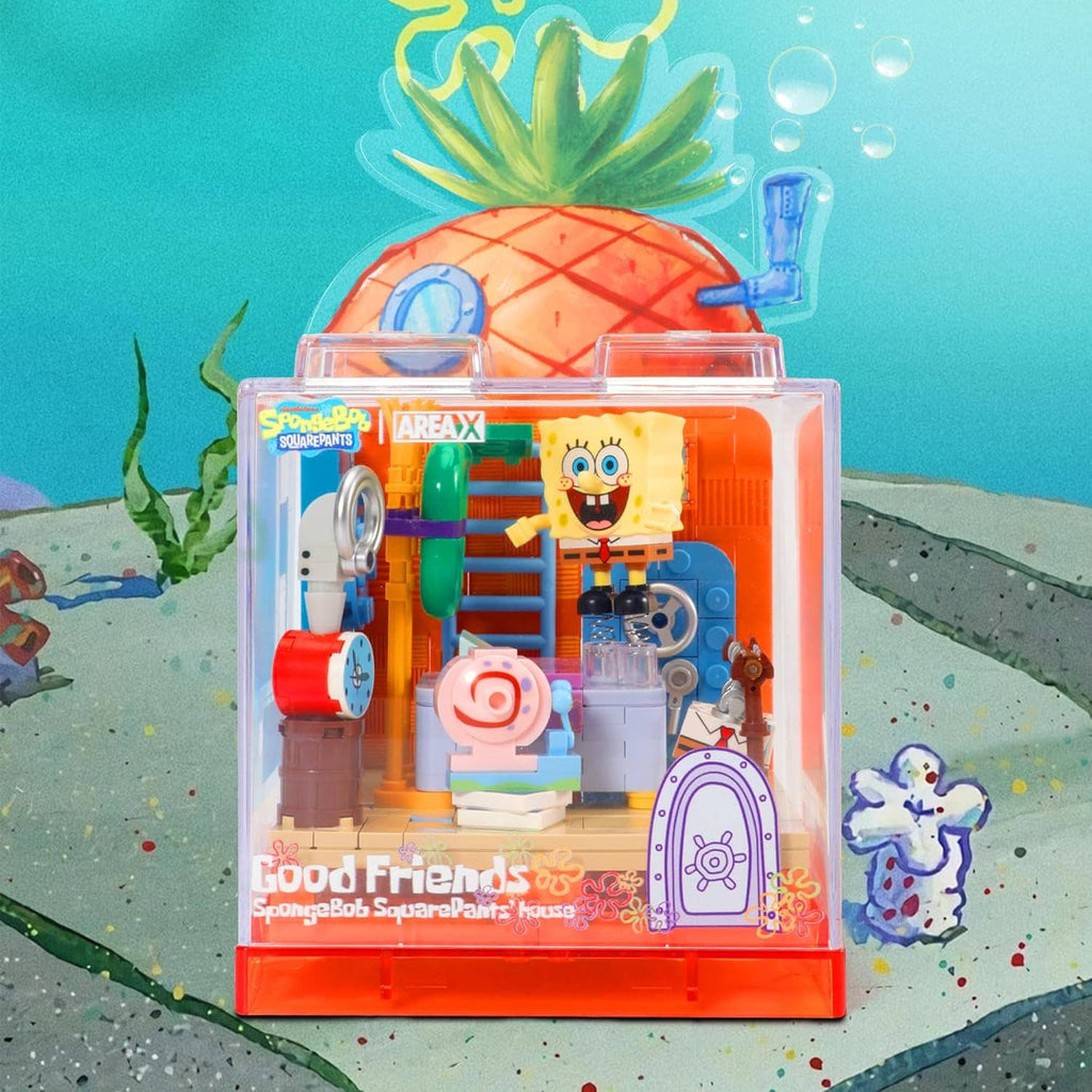 Clear pineapple-themed building block display box with character figures and colorful accessories