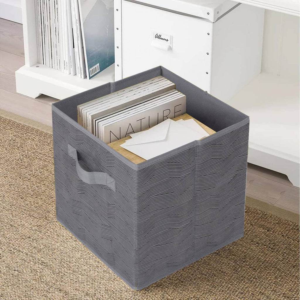 Dark gray fabric storage bin with black stripe, front opening with papers inside