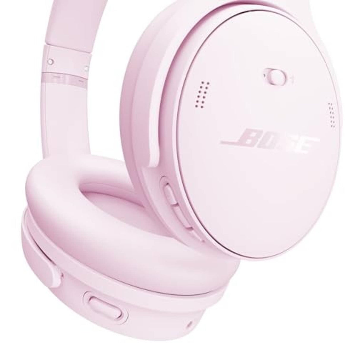 Pink wireless over-ear headphones close-up of earcup controls and logo