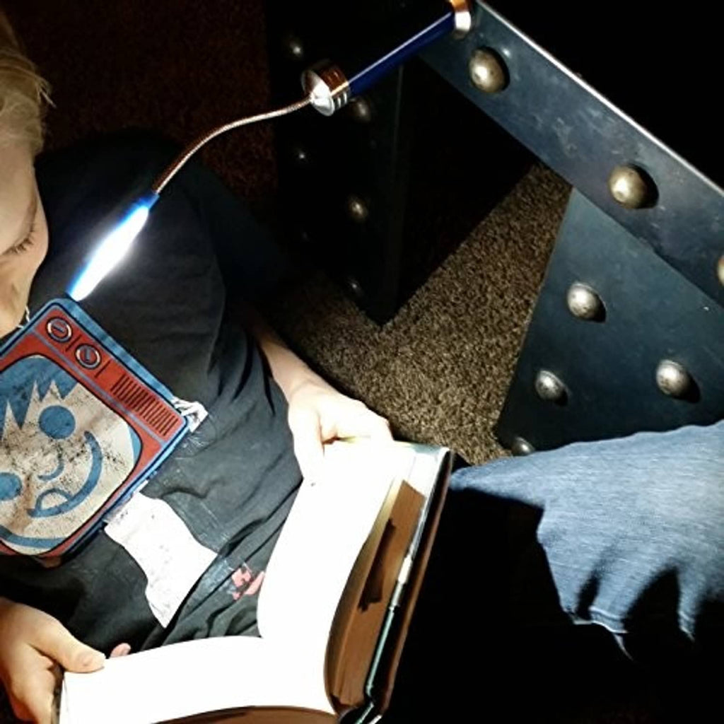 Magnetic LED COB light set shining near a floor area while a person holds a box
