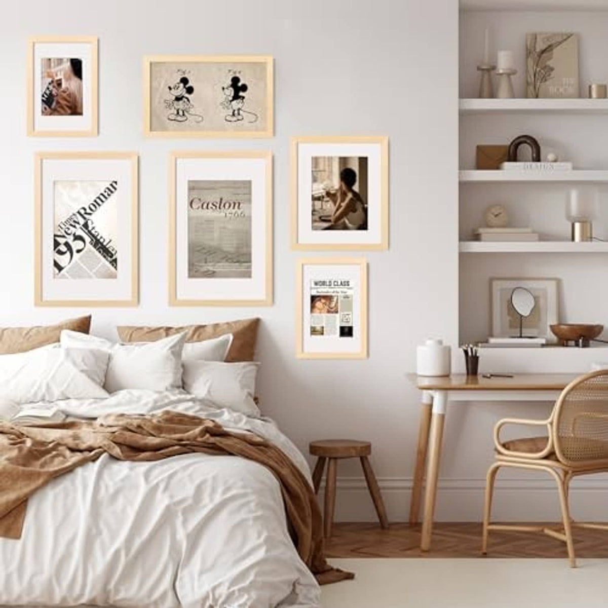 Natural wood picture frames with clear acrylic fronts arranged on a bedroom wall