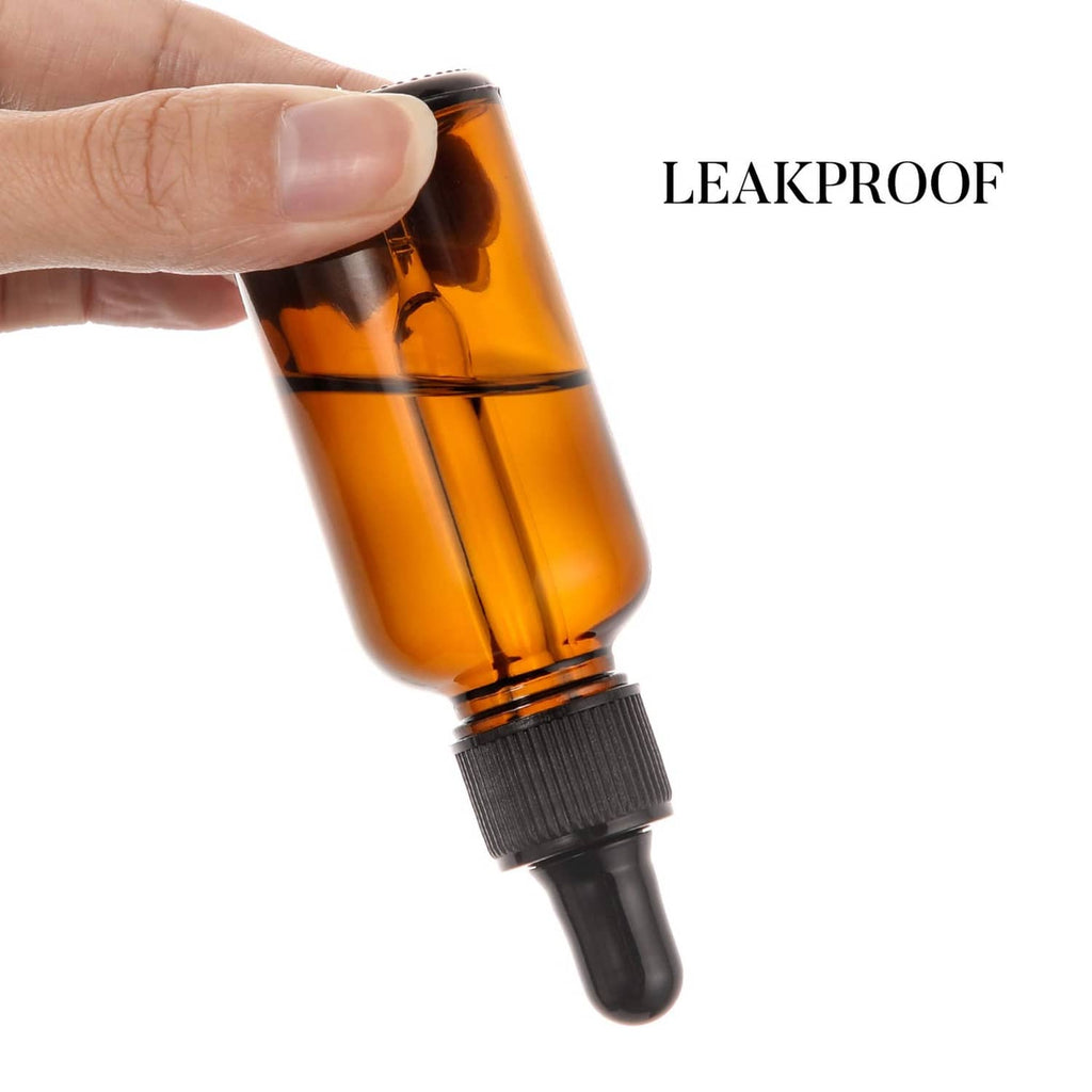 Amber dropper bottle with black cap; leakproof dispenser held by hand
