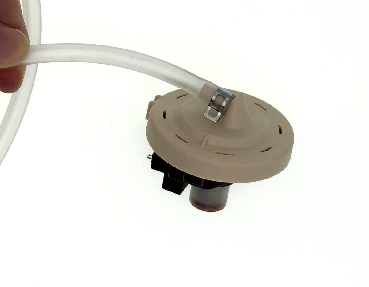 Washer pressure sensor assembly, beige housing with metal clip and white hose