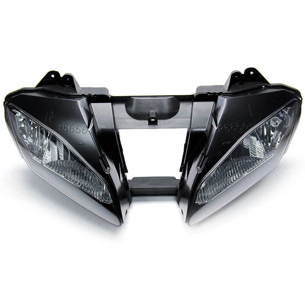 Front headlight assembly with two clear projector lenses and black outer covers
