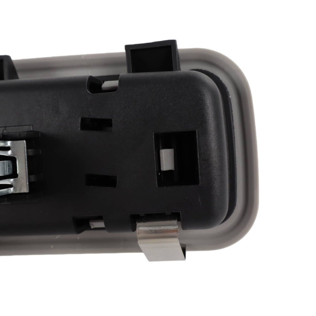 Rear dome light lamp housing corner close-up with black bezel and connector opening