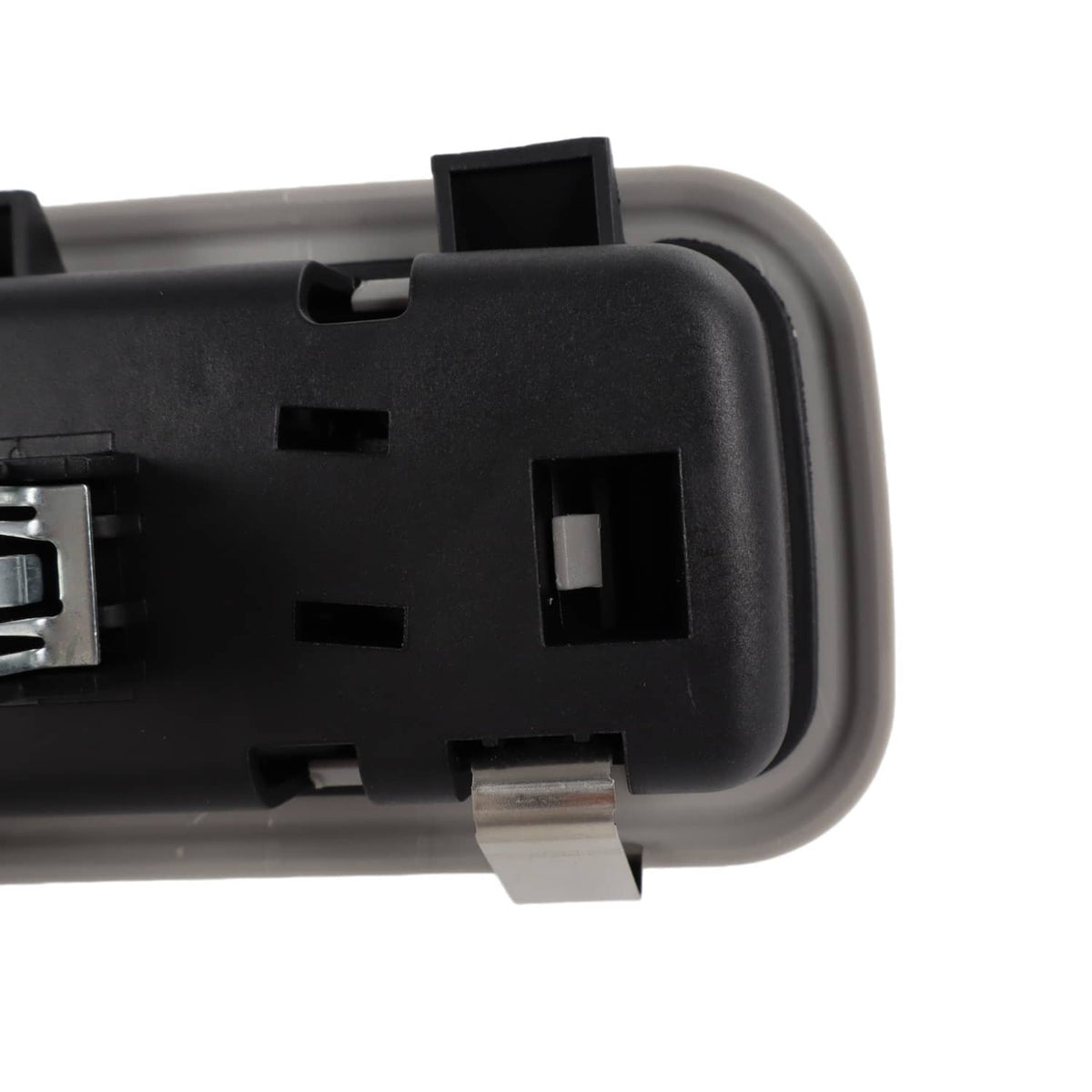 Rear dome light lamp housing corner close-up with black bezel and connector opening