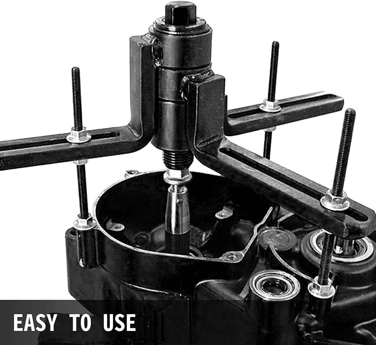 Crank case splitter puller tool mounted on engine crankcase, black frame with rod