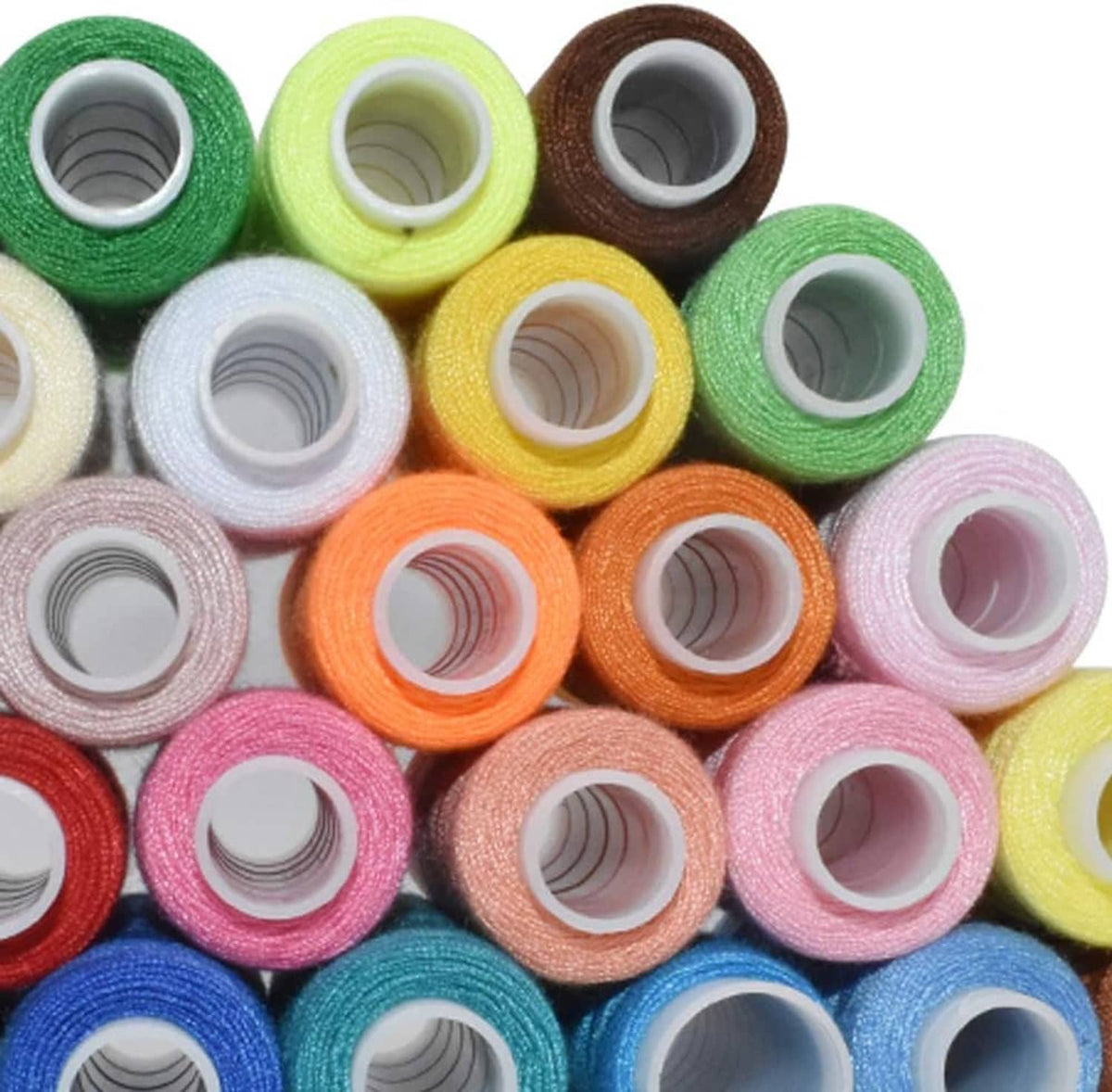 Close-up of polyester thread spools showing green, yellow, brown, pink, and blue