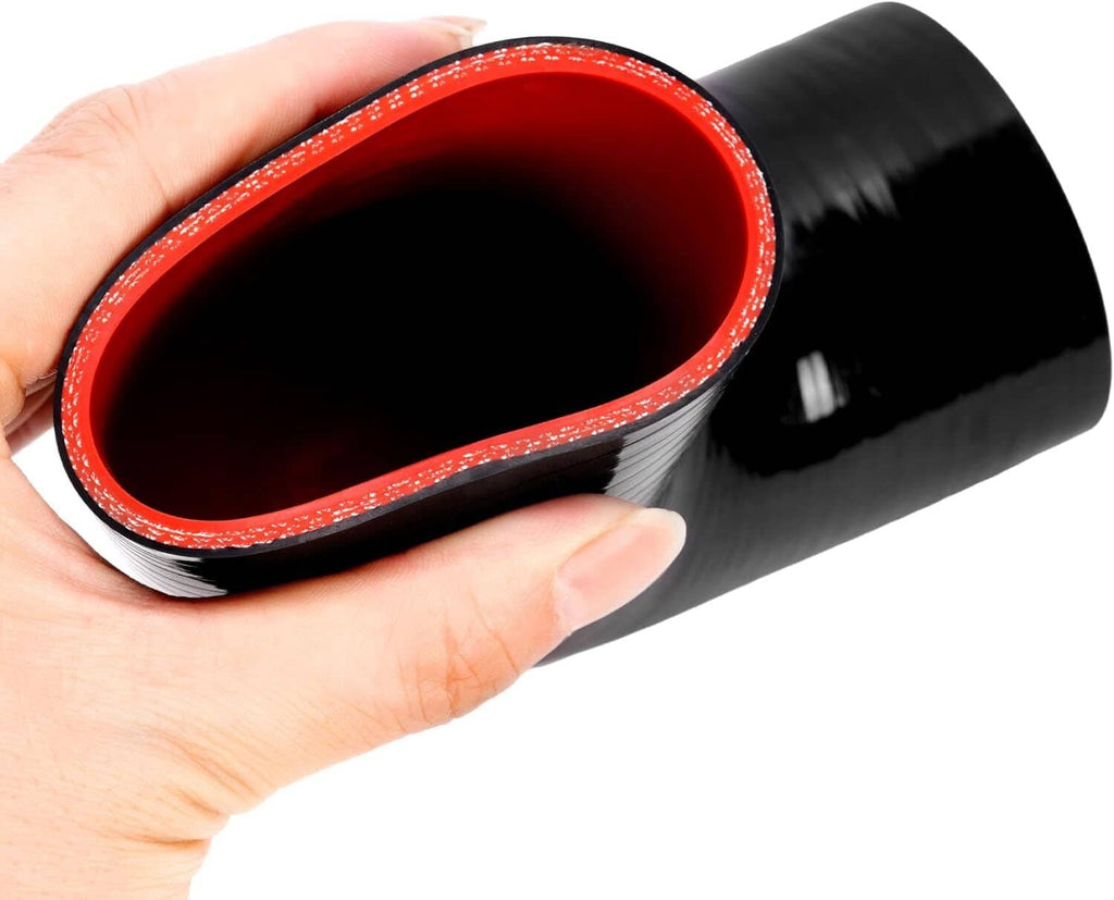 Hand holding black silicone intercooler coupler with red inner lining