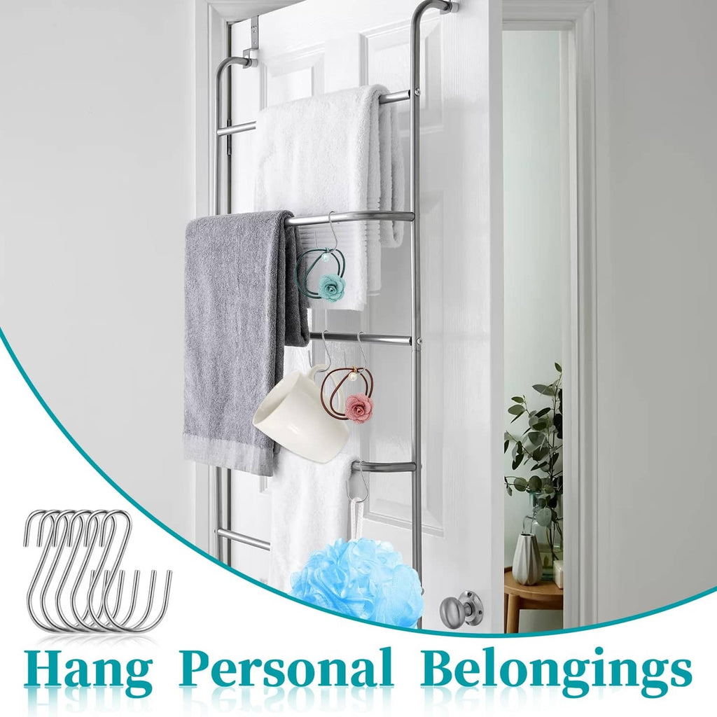 Metal S hooks on a door-mounted rack holding towels and washcloths