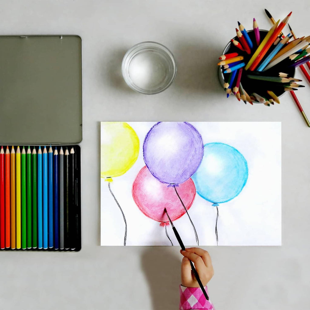 Watercolor pencil set with balloon artwork and a brush applying color