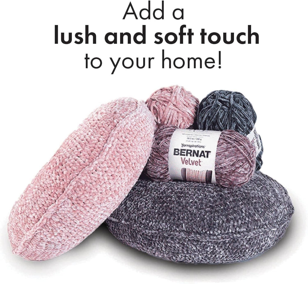 Velvet yarn skeins in pink and charcoal gray with band label