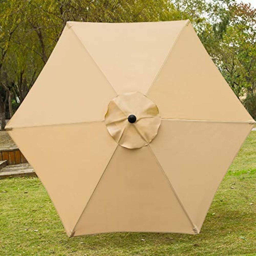 Tan outdoor patio umbrella fully open with circular top vent and black pole