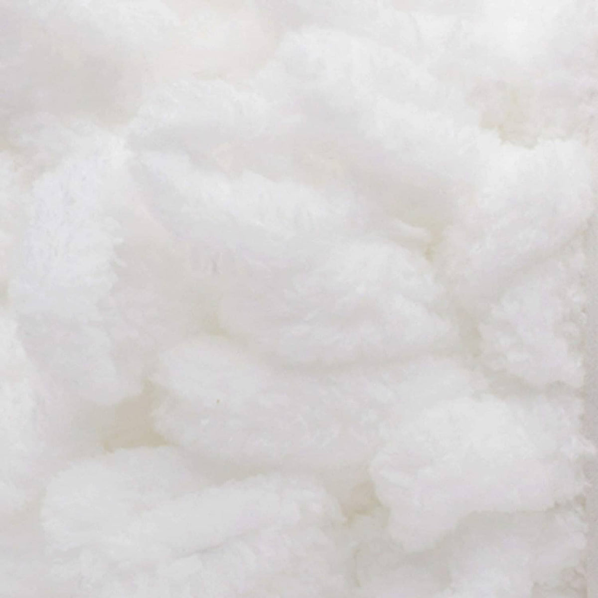 Close-up of white chunky Bernat Alize Blanket-EZ yarn with plush, raised loops