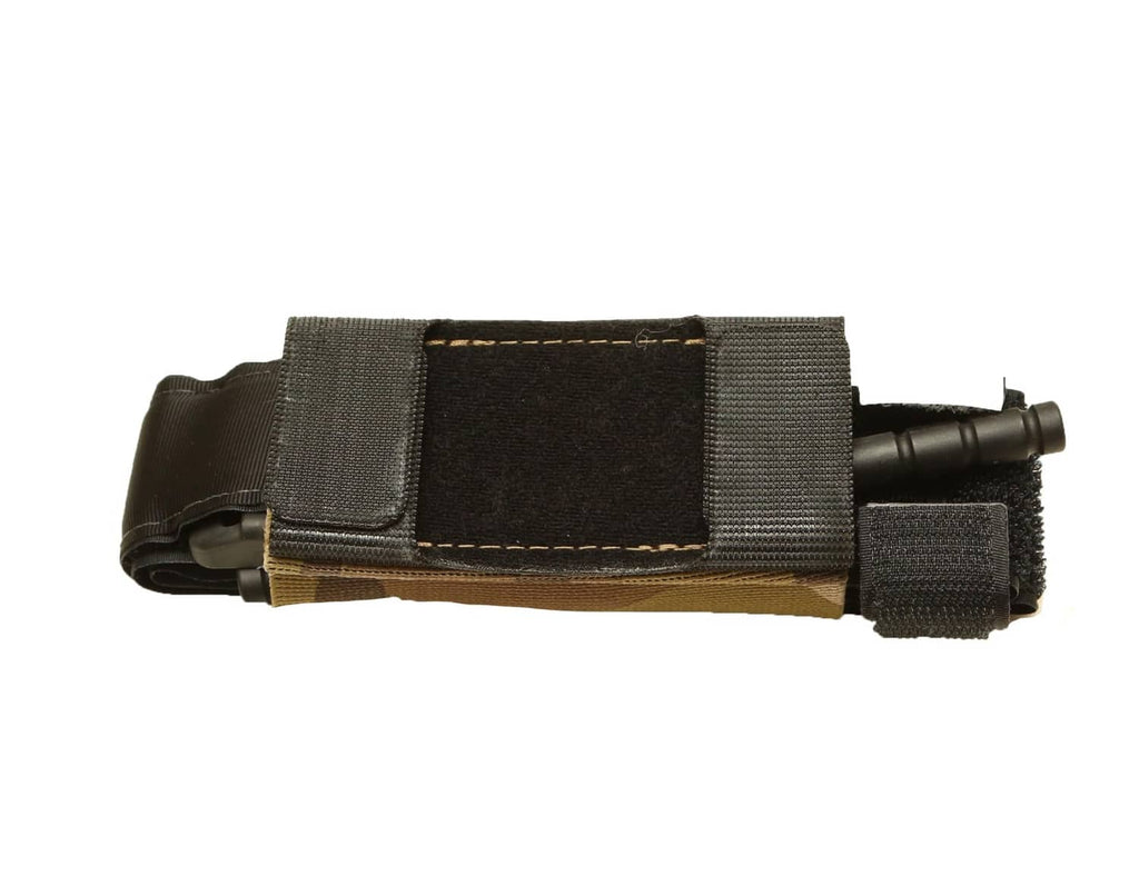 Multicam tourniquet holder pouch on belt with black webbing keeper and elastic strap