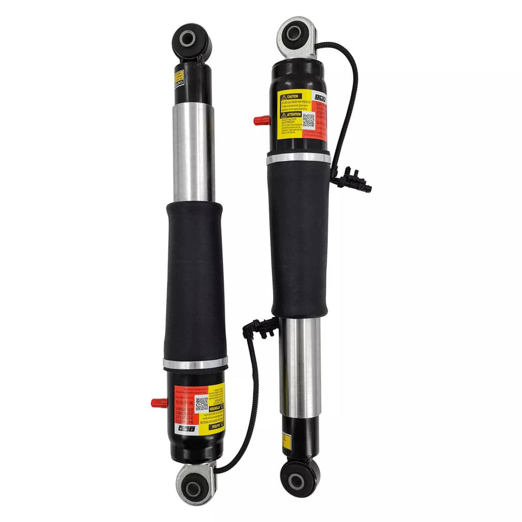 Pair of rear air shock absorbers with black sleeves, silver rods, and top mounts