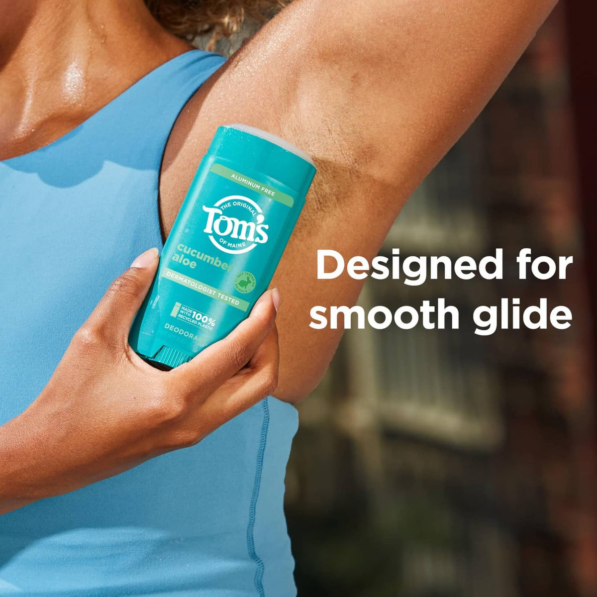 Tom's cucumber aloe aluminum-free deodorant stick held near underarm