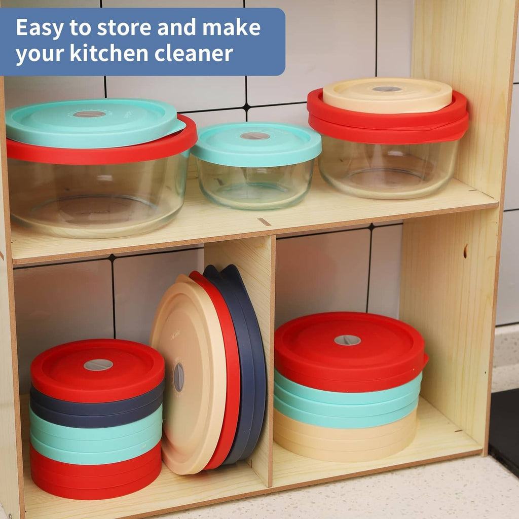 Dark blue replacement lid stored on a kitchen shelf with other stacked lids