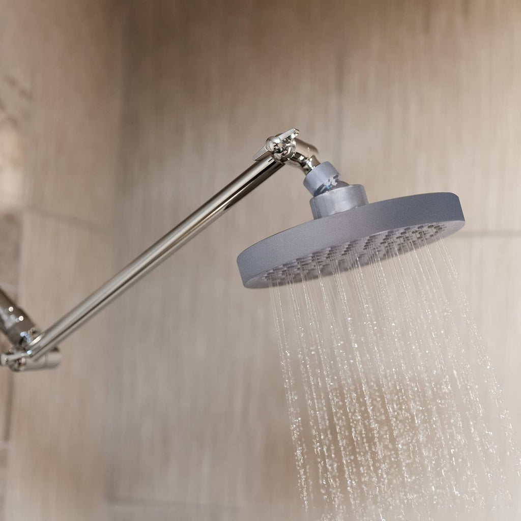 Charcoal grey 6-inch round rain shower head releasing steady water spray