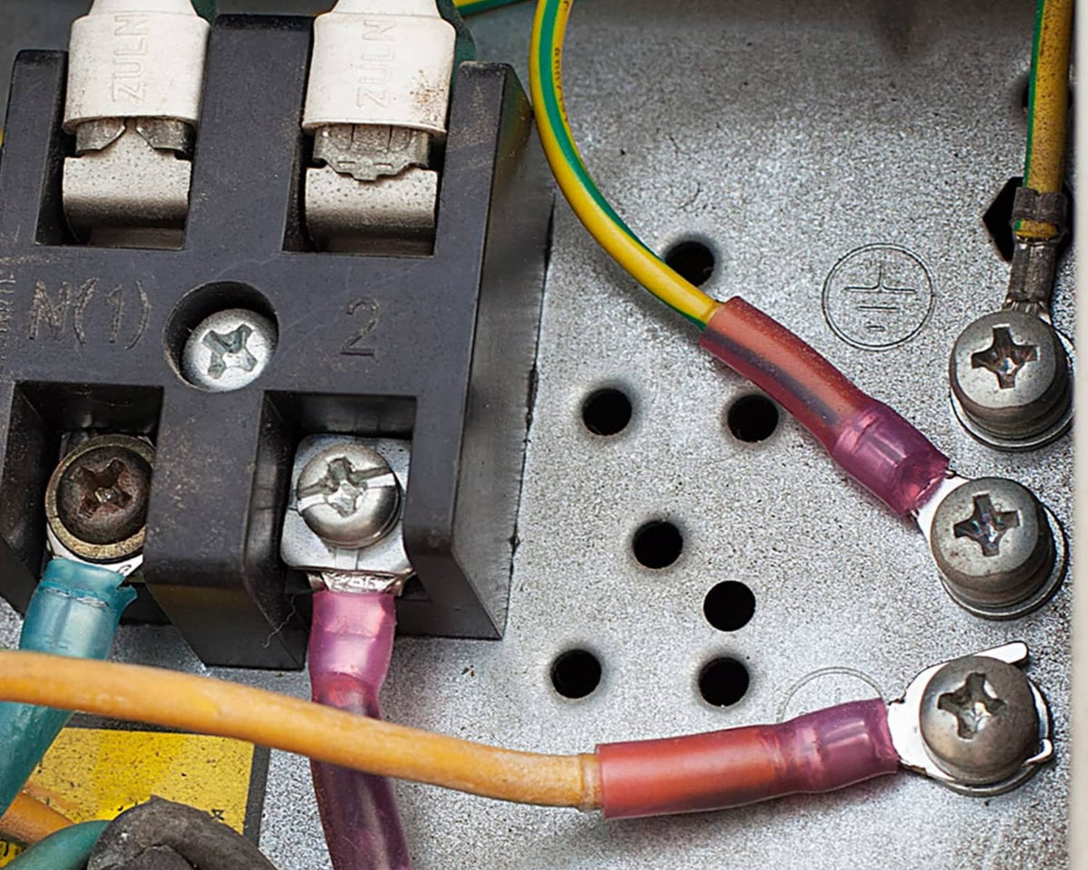 Electrical terminal block with wires using red heat-shrink crimp connectors