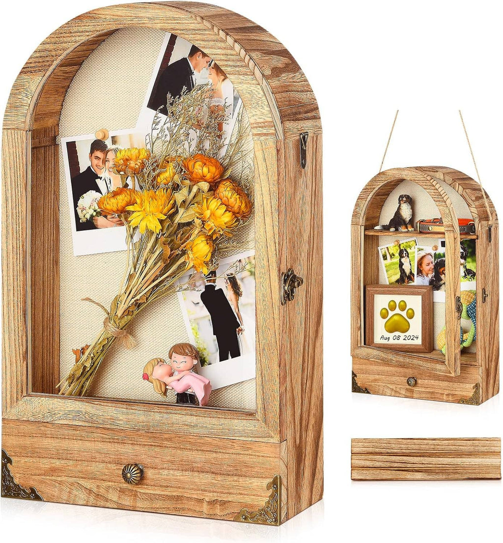 Large arched shadow box display case with linen back, floral bouquet, and photo cards