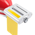 White pasta roller and cutter attachment with yellow pasta sheet and metal rollers