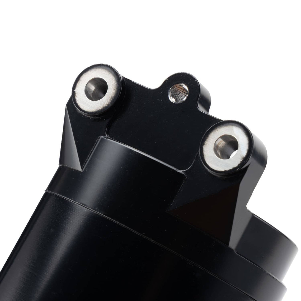 Detail view of black starter motor mounting bracket with two metal fasteners