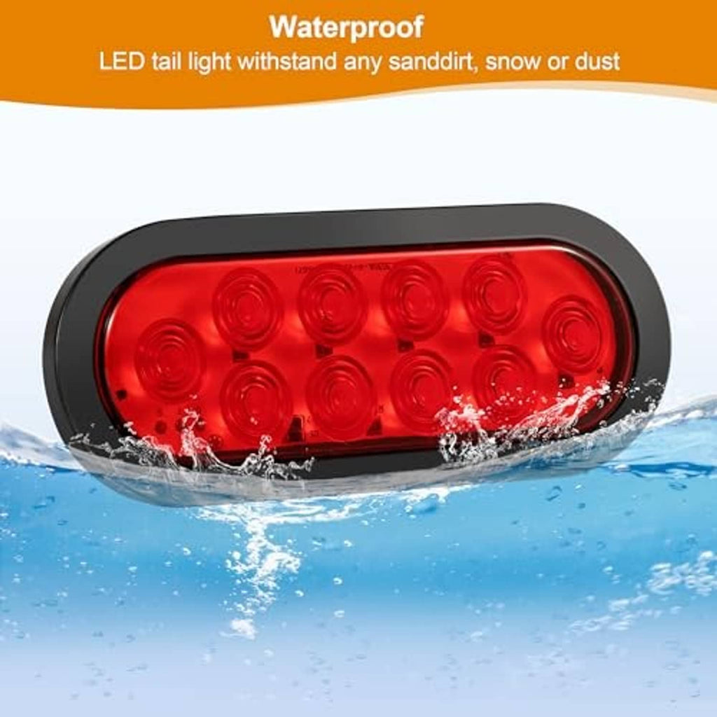 Oval red LED tail light with black housing, shown with splash water around lens