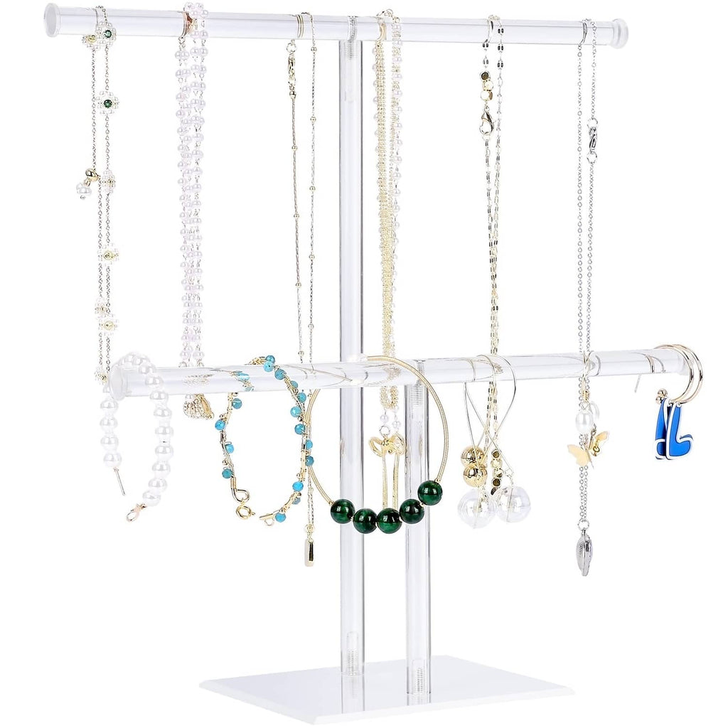 Clear acrylic jewelry necklace holder stand with hanging rods and displayed chains